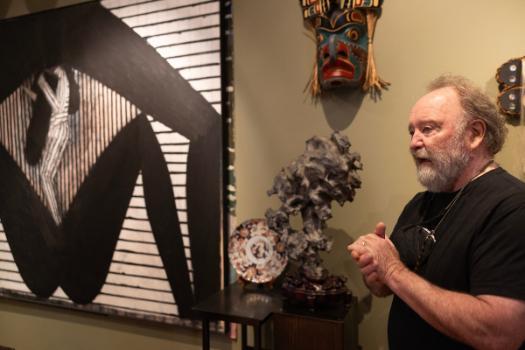 Dennis Evans with art in background