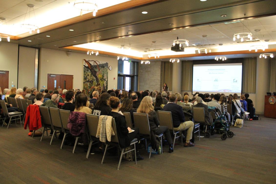 People in ballroom listening to speaker at Climate summit