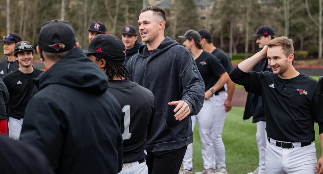 Skubal on field with players